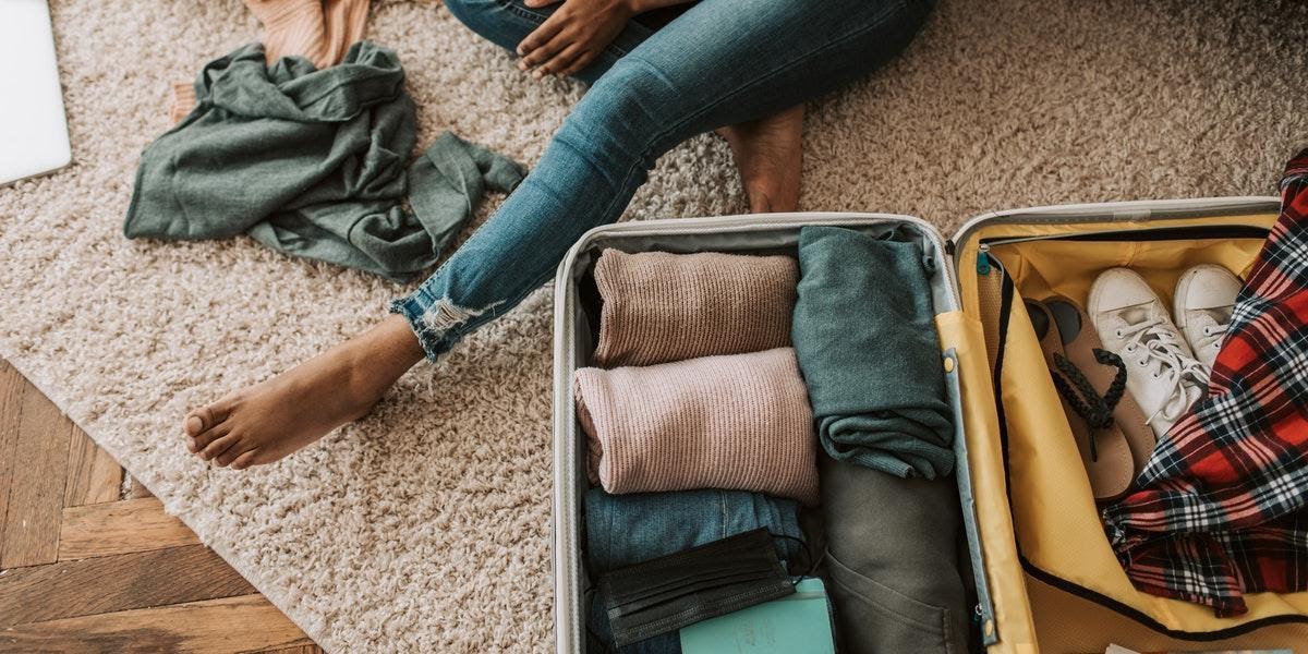 Woman packing suitcase for rehab