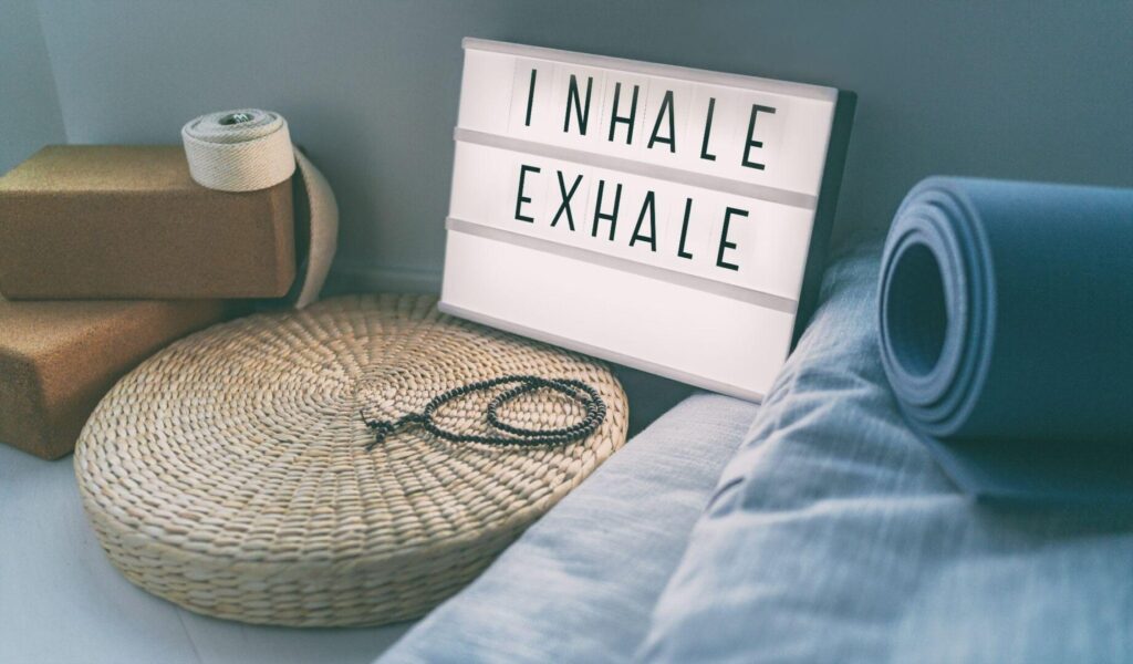 A sign that says inhale exhale on it.